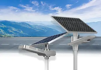 Two solar lamps with a mountainous landscape in the background
